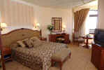 A Bedroom at the Alexander the Great Hotel