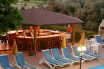 Relax with a cool drink at the Pool Bar of the AlkioNest Hotel Apartments