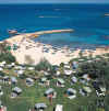 Cavo Maris Hotel Garden leading down to the sandy beach and blue sea, click to enlarge this photograph