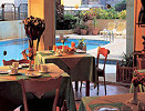 Dining by the pool at the Chrielka Hotel Apartments in Limassol