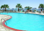 De Costa Hotel Pool with the Sea in the Background