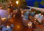 The outdoor bar by night at the Grecian Park Hotel, Cape Greco, Protaras