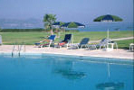 Relax by the swimming pool at the Natura Beach Hotel in Polis