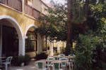 Relax under the trees in the Veranda area